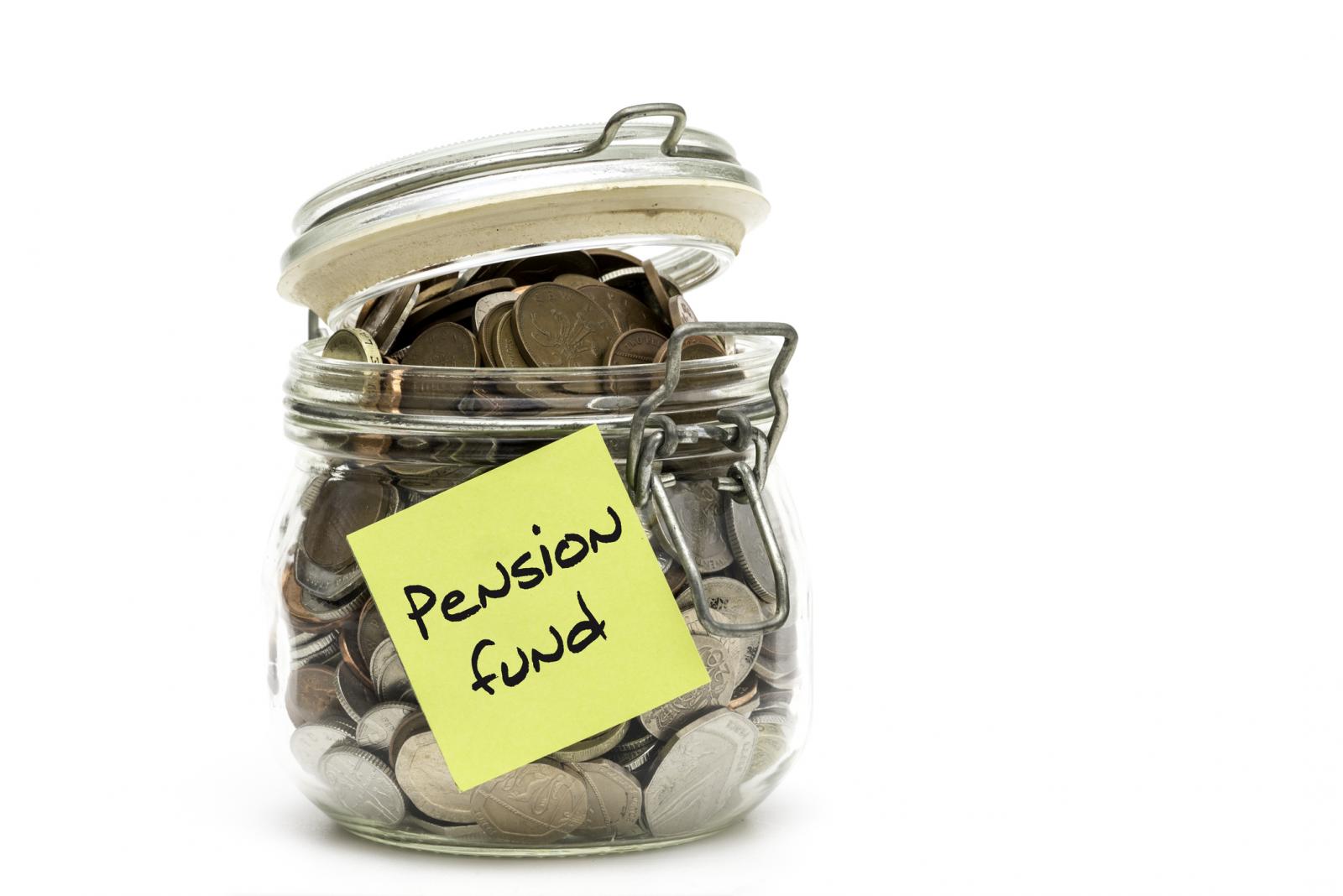 jar of coins with sticky note reading 'Pension Fund'
