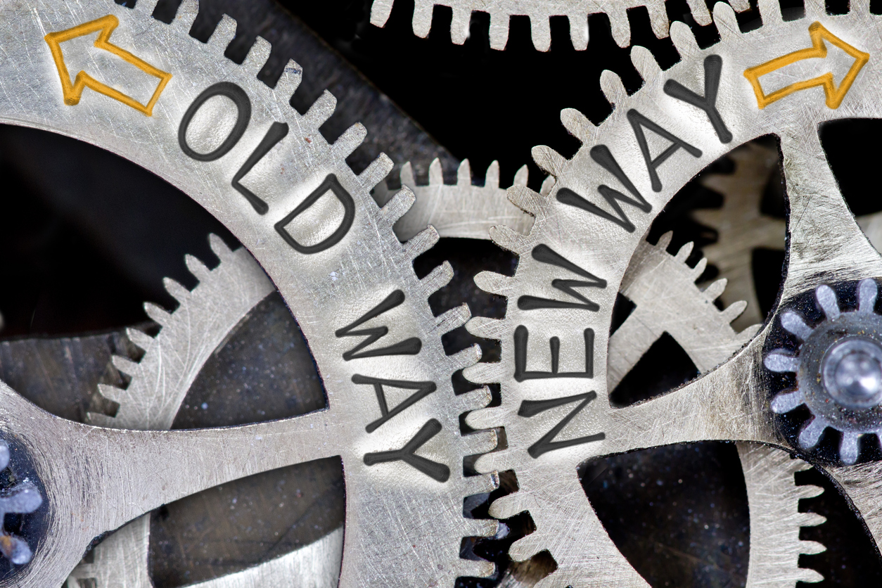 metal cogs with text saying 'old way/new way'