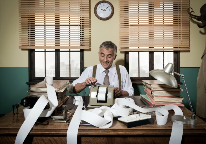 The evolution of bookkeeping - image of bookkeeper at desk