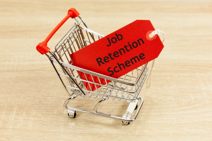 Managing your payroll during uncertain times - small trolley with label inside reading job retention scheme