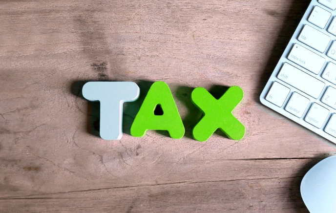 Making Tax Digital (MTD) reminder and updates - word tax on wooden background