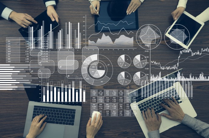 switch your bookkeeping system - circle of laptops with graphs and data overlay