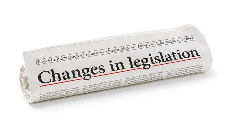 A rolled-up newspaper with the headline ‘Changes in legislation’